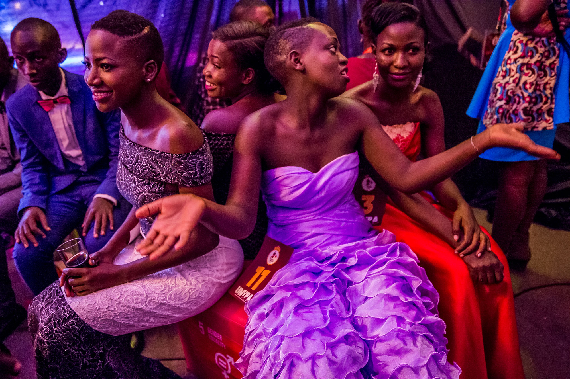 A group of contestants wait backstage at the Y+ Beauty Pageant, a contest developed for young people living with HIV in Uganda.