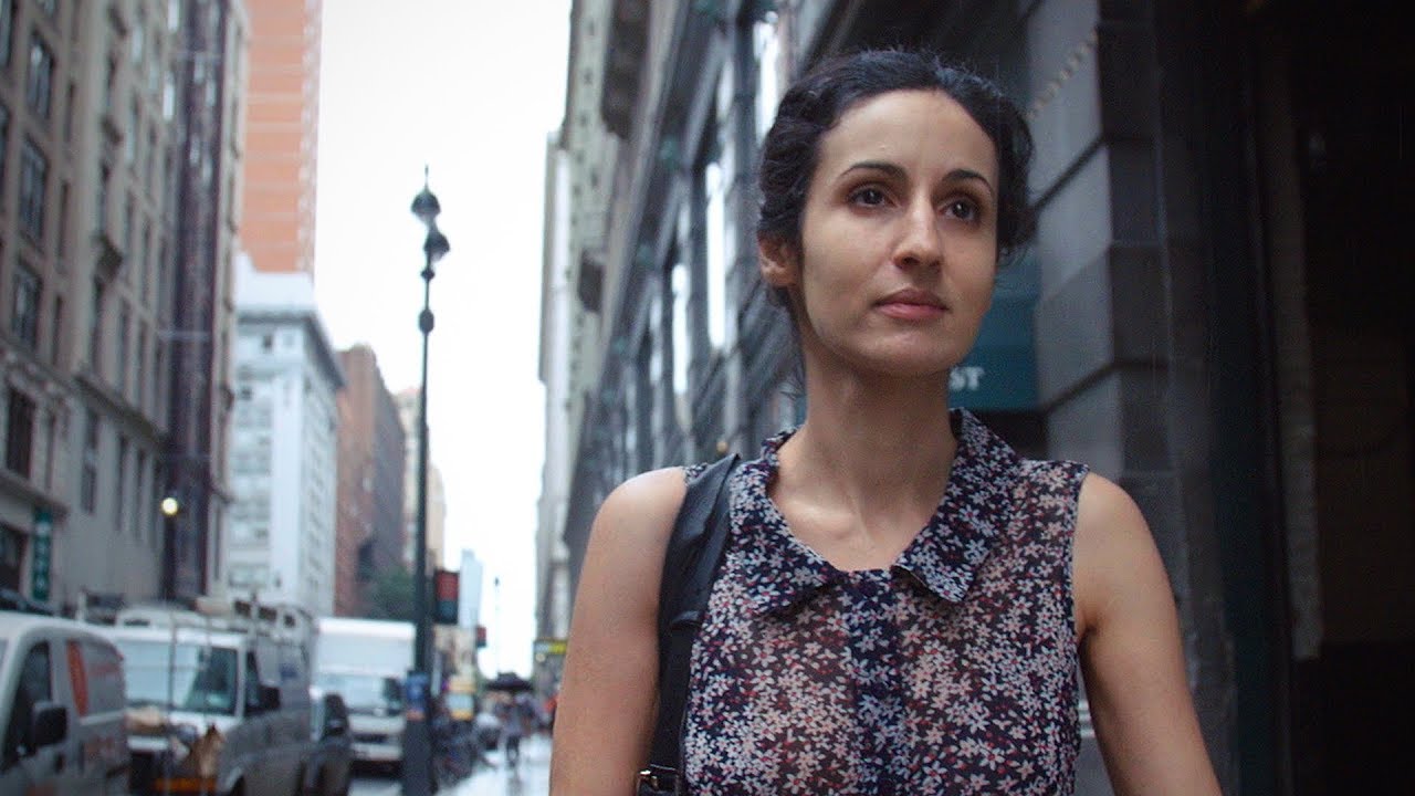 The artist Mariam Ghani walks down a street in New York.