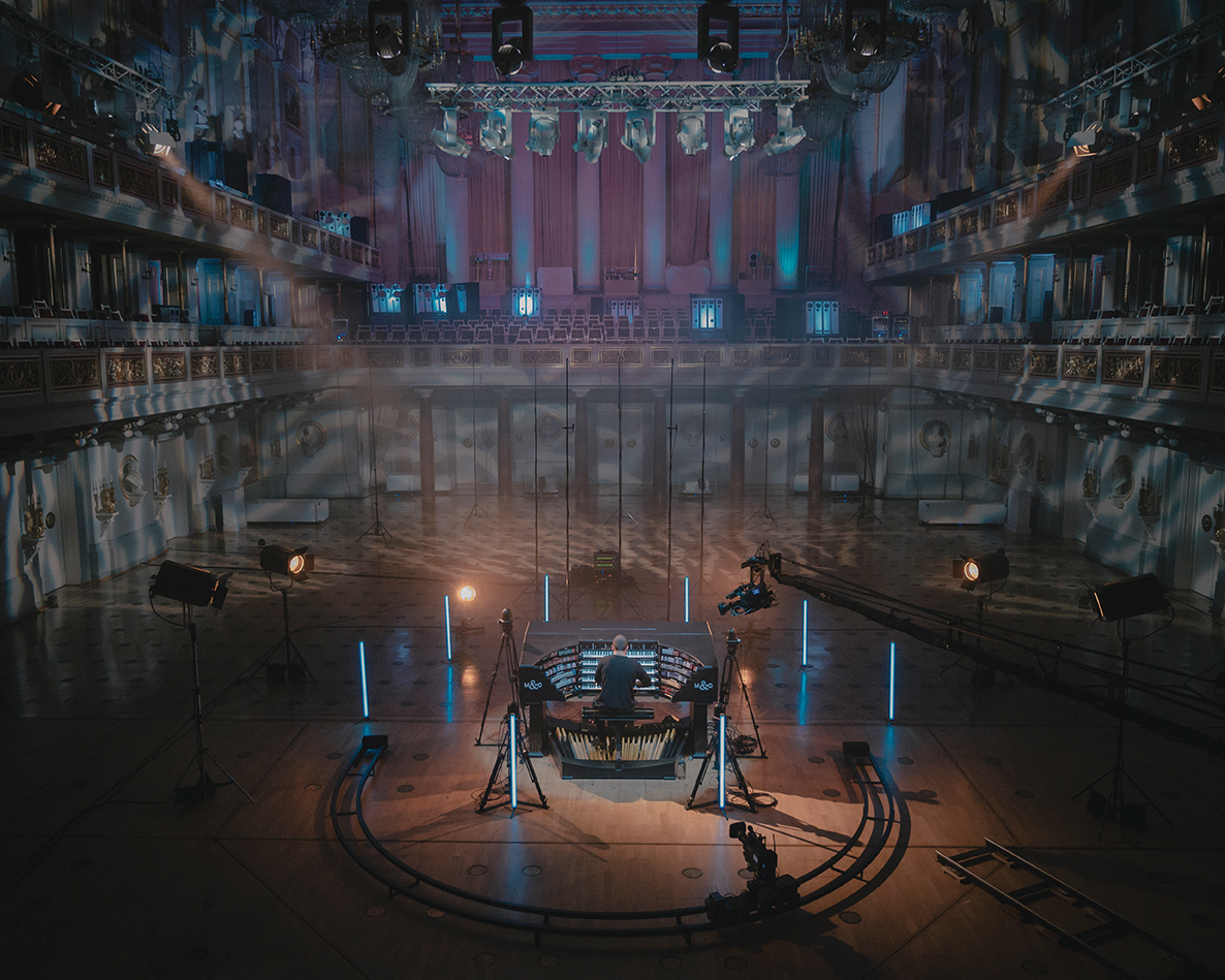 An organist practices in an empty concert hall, with no spectators allowed due to the pandemic.