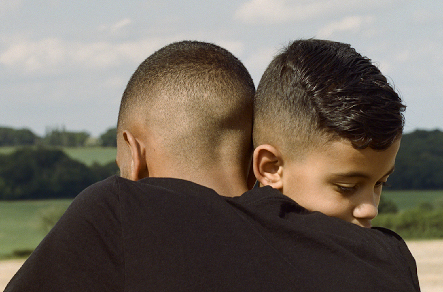 Josh hugs his little brother, Tanny. This image was taken a few days after the UK government eased lockdown restrictions. 