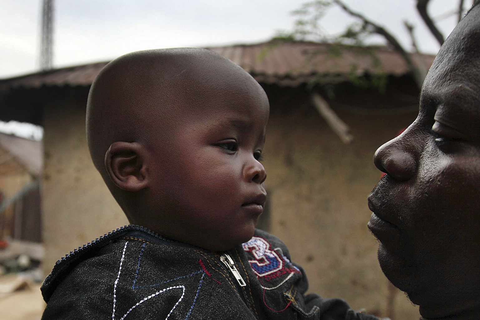 Father holding his toddler son in Bauchi, one of the regions in Nigeria affected by Lassa fever