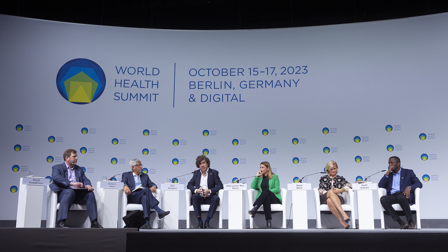 Panellists sit on a stage at the 2023 World Health Summit in Berlin.