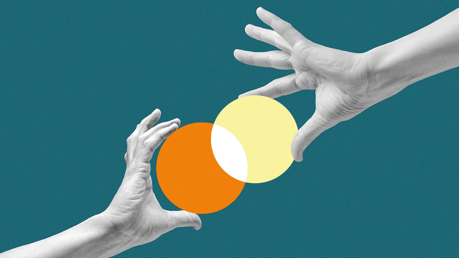 Two hands holding an orange circle and a yellow circle.