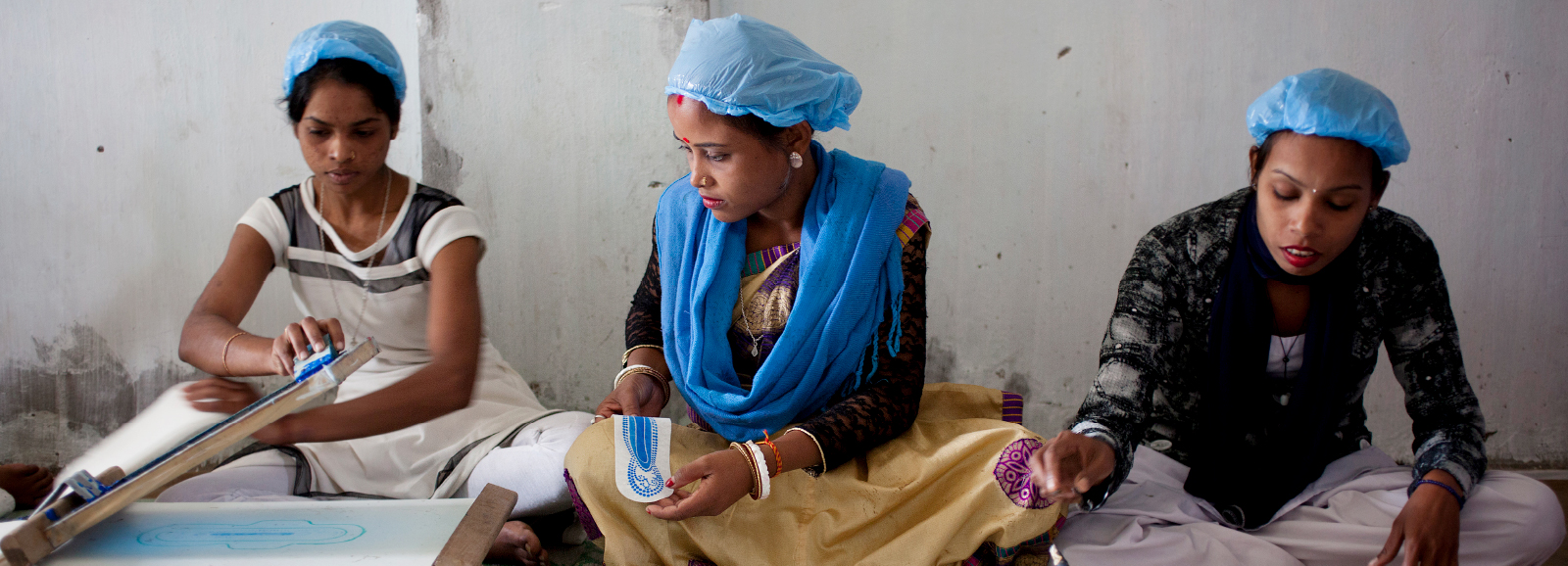 Women working at the Sanitary Pad Unit on the Amgoorie Tea Estate in Assam, India