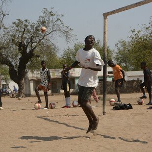 Young men playing football