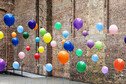 Colourful balloons in empty warehouse 