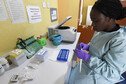 A health official works in the laboratory extraction room of the Institute of Lassa Fever Research and Control in Nigeria.
