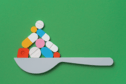 Illustration of a spoon with pills