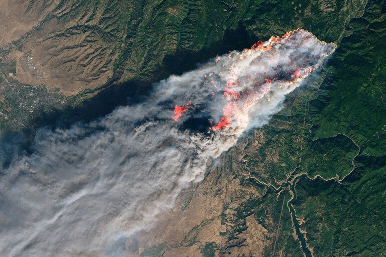 A satellite image of a wildfire in California.