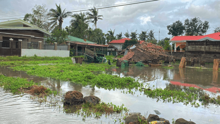 A flooded residential area in the Philippines.
