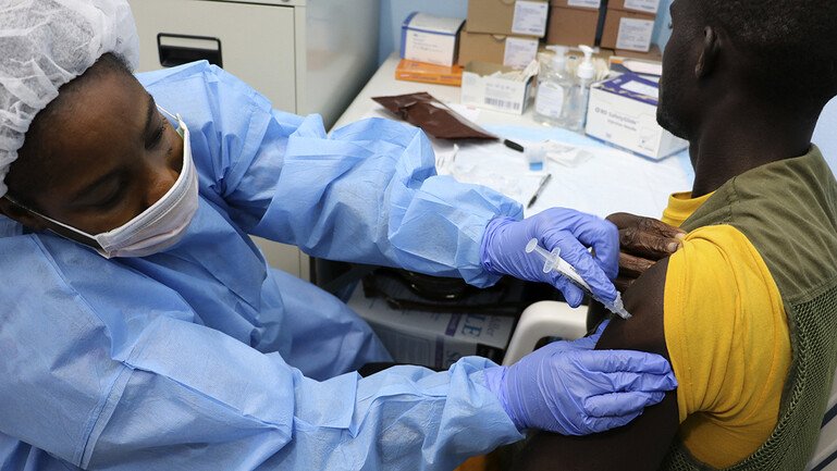 A man being vaccinated in an Ebola vaccine trial in Liberia