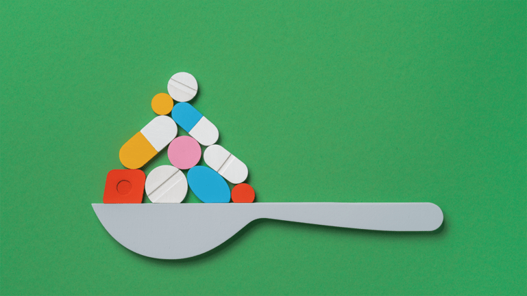 Illustration of a spoon with pills