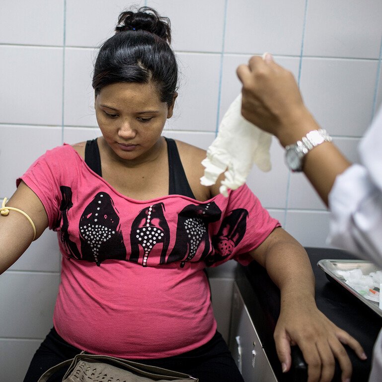 Pregnant woman in Sao Paulo having a blood test in hospital.