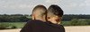 Two brothers hug in a park a few days after lockdown restrictions were eased.