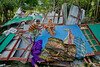 A family mourns atop the ruins of their house, destroyed by 2019 cyclone Fani.