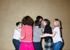 A group of women link arms while performing one of the rituals designed to alleviate the stress of city living. 