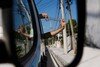 Man releasing a tube of mosquitoes that carry Wolbachia from his car window.