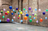 Colourful balloons in empty warehouse (Image © Anthony Harvie/Getty Images)