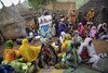 A health educator talks to women about mother and child healthcare in a village in Chad. 