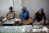 Women working at the Sanitary Pad Unit on the Amgoorie Tea Estate in Assam, India.